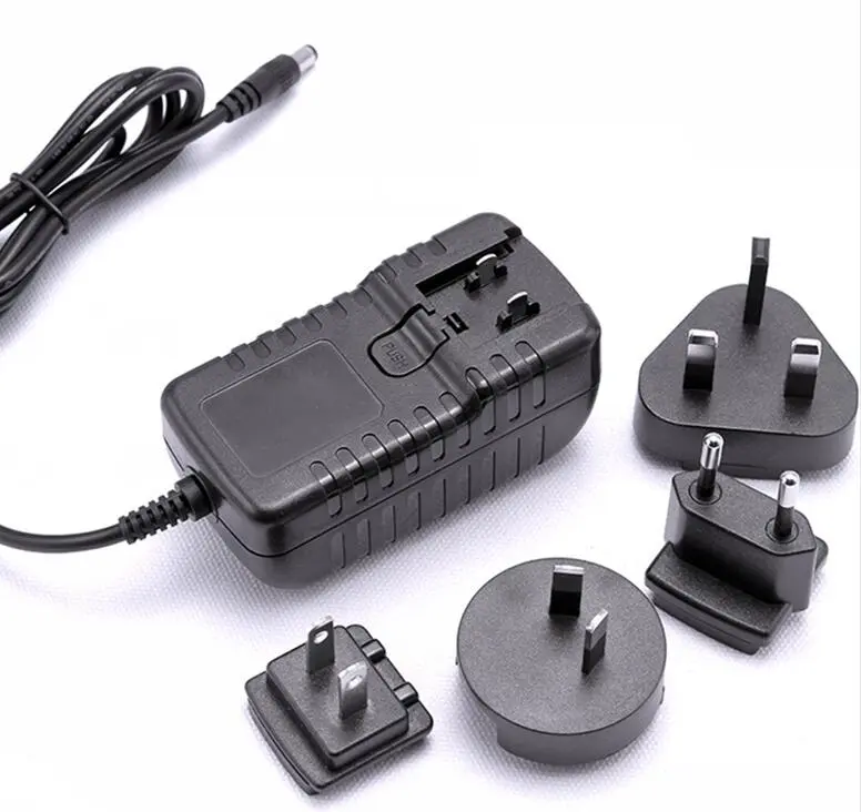 Why do people traveling around the world prefer adapters with replaceable plugs?